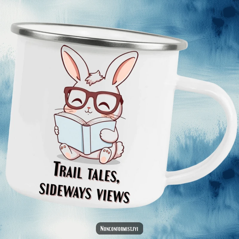 Funny bunny camping mug showing a curious rabbit with glasses, reading a sideways book, great for humorous outdoor reading.