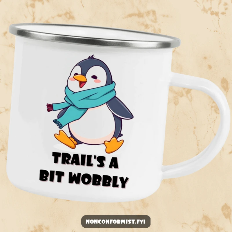 Rugged camping mug with a funny penguin wearing a scarf, comically tripping, outdoor fun.