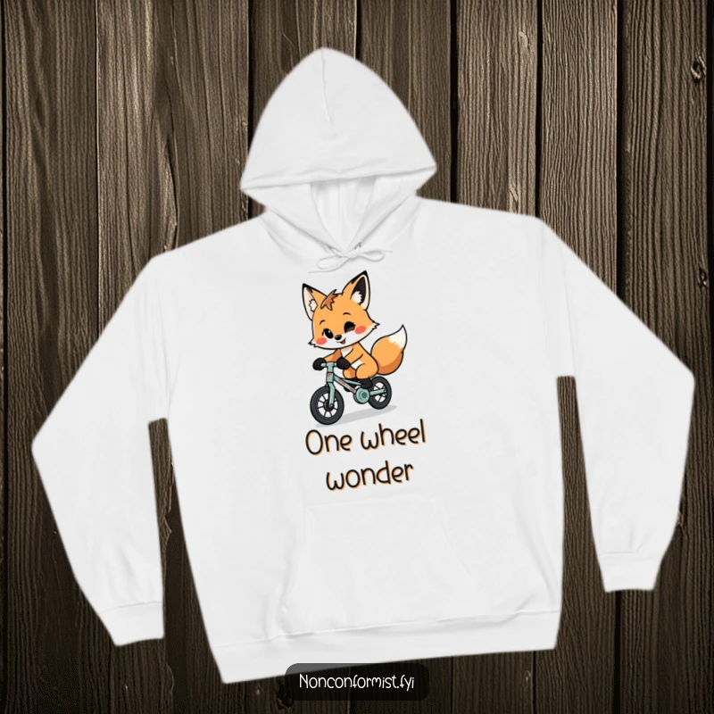 Funny, quirky fox with a playful smirk rides a tiny, patched-up unicycle on this soft and cozy hoodie.