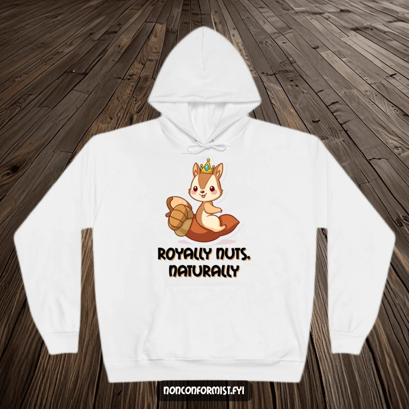 Funny hoodie depicting a mischievous squirrel king in a crown, joyfully riding a large rolling acorn.