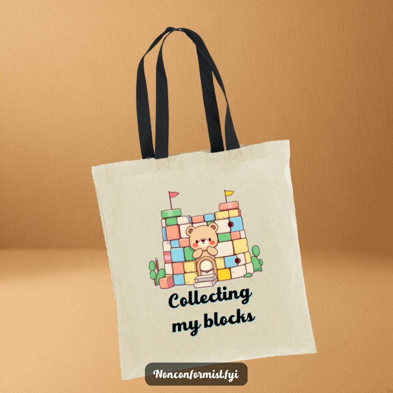 Funny Little Bear Tote Bag: Features a little bear character building a fort from colorful blocks, ideal for carrying items with playful charm.