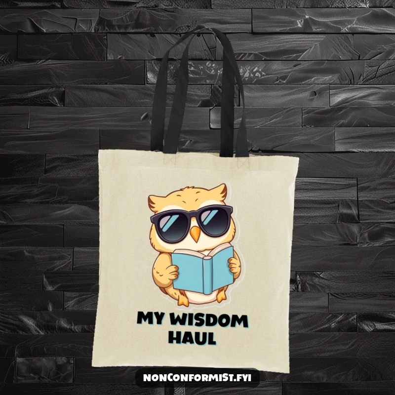 Funny tote bag with a smiling, sunglass-clad owl reading a book held upside down, a quirky accessory for book lovers.